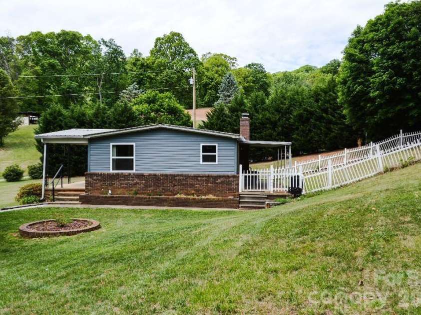 188 Wiggins Road, Candler, NC 28715.  MLS# CAR4377561, YatesRealty ID 19126. Side view
