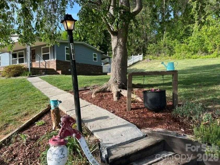 188 Wiggins Road, Candler, NC 28715.  MLS# CAR4377561, YatesRealty ID 19126. Walk way