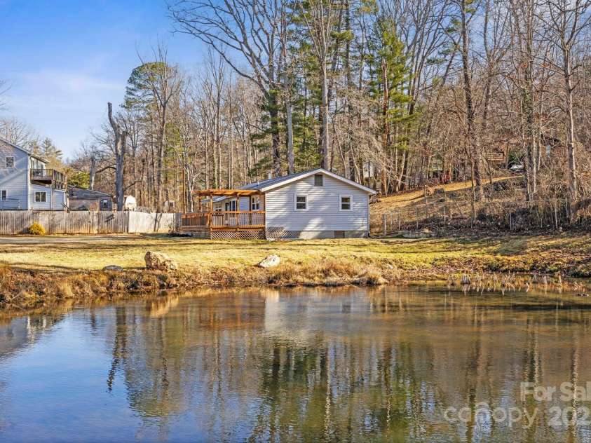 16 Rosscraggon Drive, Asheville, NC 28803.  MLS# CAR4219971, YatesRealty ID 19128. Stocked pond