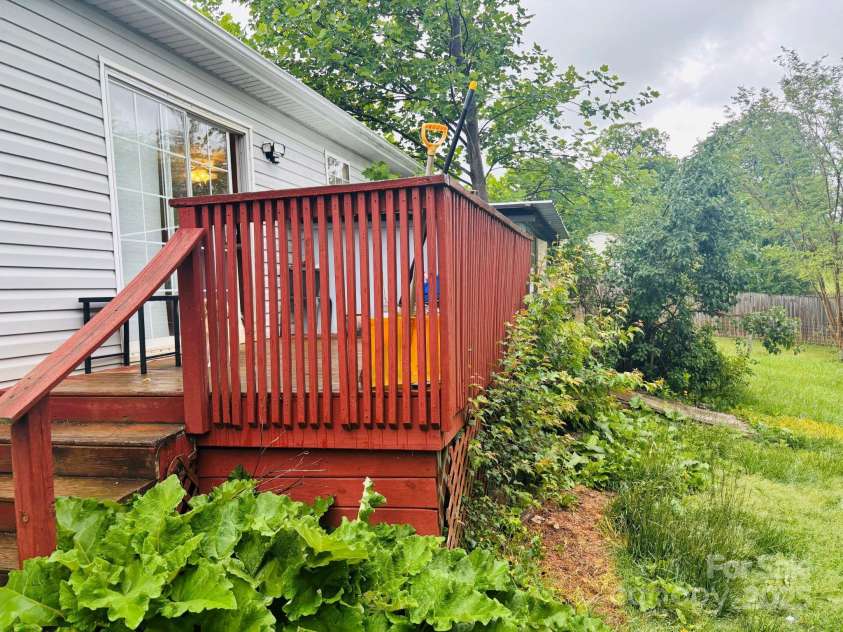 16 English Oaks Drive, Candler, NC 28715.  MLS# CAR4258090, YatesRealty ID 19142. Back deck
