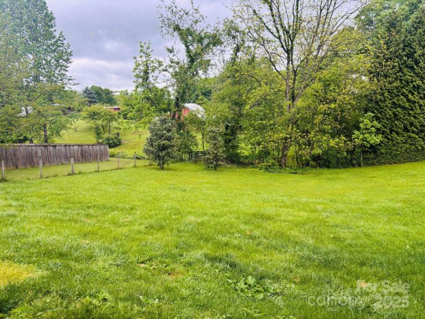 16 English Oaks Drive, Candler, NC 28715.  MLS# CAR4258090, YatesRealty ID 19142. Fenced backyard
