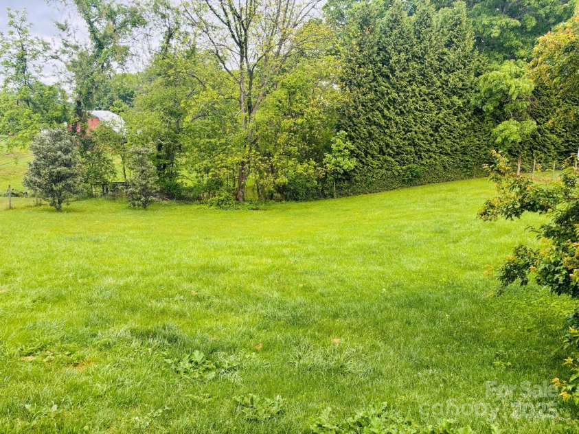 16 English Oaks Drive, Candler, NC 28715.  MLS# CAR4258090, YatesRealty ID 19142. Fenced backyard