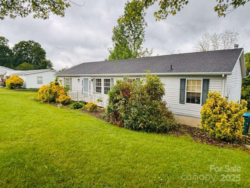 16 English Oaks Drive, Candler, NC 28715.  MLS# CAR4258090, YatesRealty ID 19142. Front of home