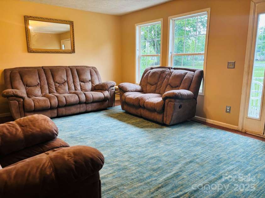 16 English Oaks Drive, Candler, NC 28715.  MLS# CAR4258090, YatesRealty ID 19142. Living room