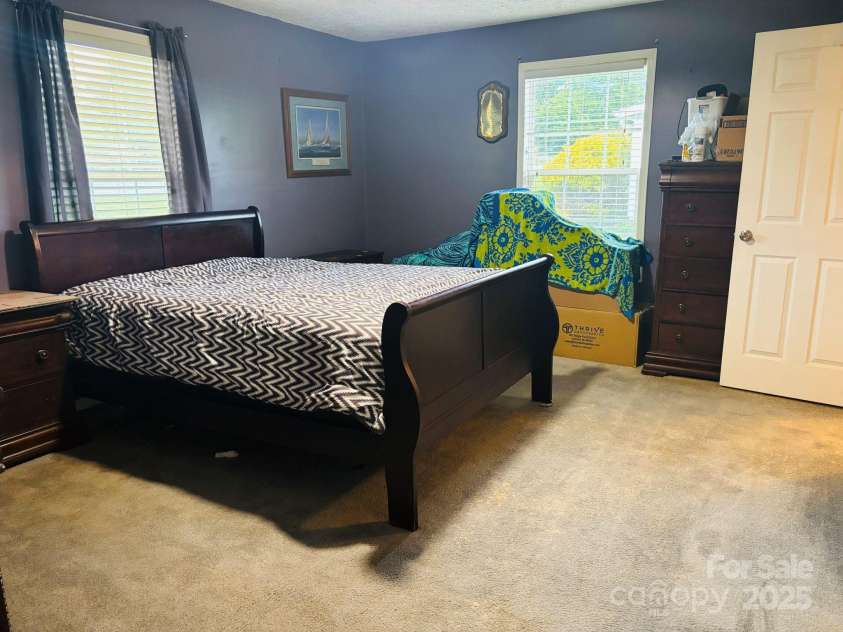16 English Oaks Drive, Candler, NC 28715.  MLS# CAR4258090, YatesRealty ID 19142. Primary bedroom