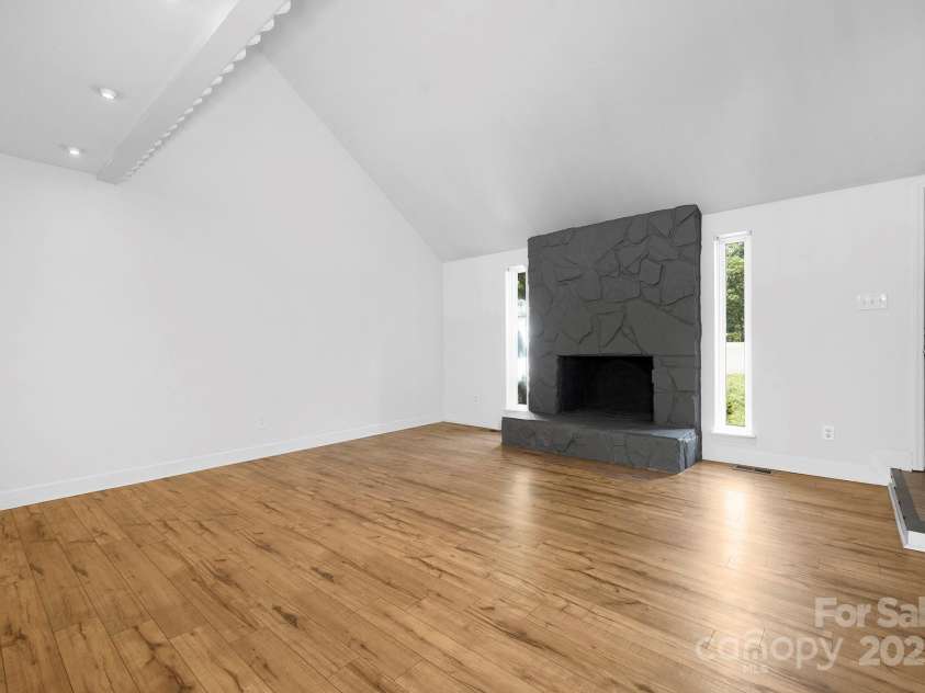 10101 Wood Court, Charlotte, NC 28277.  MLS# CAR4268074, YatesRealty ID 19152. Living Room with Vaulted Ceiling and statement fireplace
