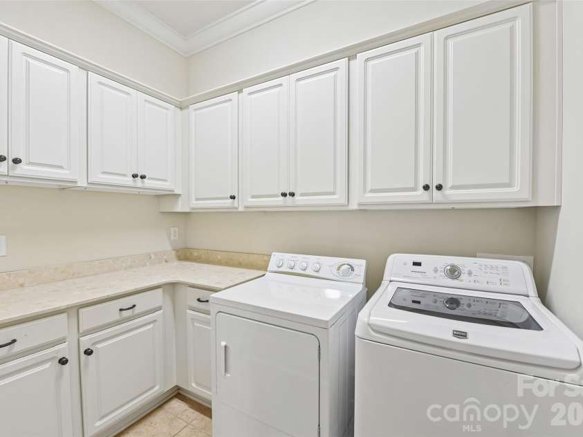 5208 Shepley Court, Charlotte, NC 28226.  MLS# CAR4366293, YatesRealty ID 19154. Designed for efficiency and streamlined utility, the laundry is the larger than other floorplan units in this community
