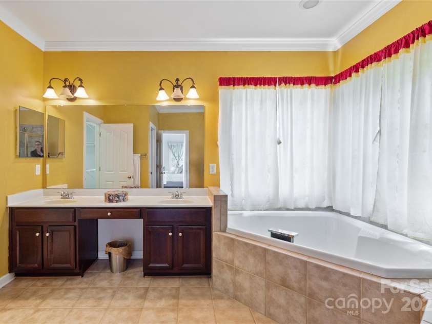 8914 Landsdowne Avenue, Harrisburg, NC 28075.  MLS# CAR4259422, YatesRealty ID 19156. Another view of vanily.