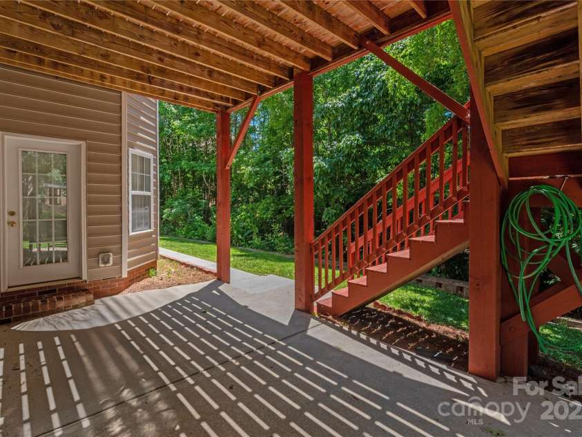 8914 Landsdowne Avenue, Harrisburg, NC 28075.  MLS# CAR4259422, YatesRealty ID 19156. Patio from the basement.