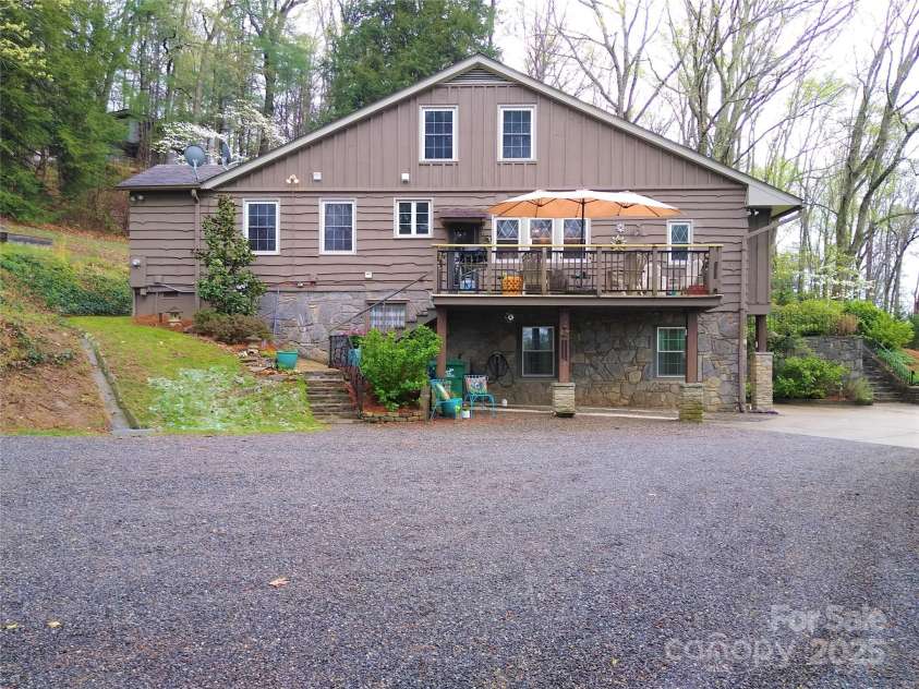242 Birch Lane, Arden, NC 28704.  MLS# CAR4249293, YatesRealty ID 19164. 20' x 12' Aluminum Deck plus plenty of extra parking.with a carport underneath