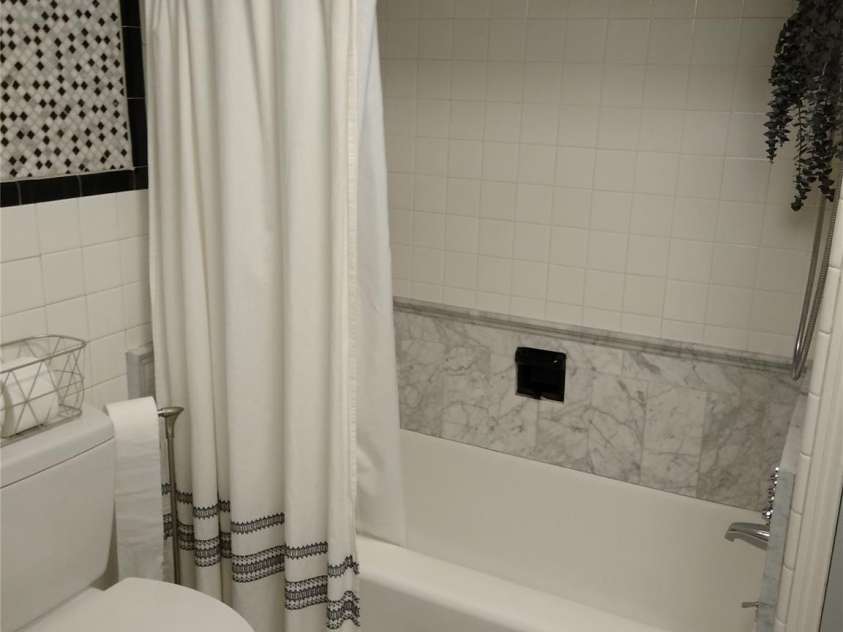 242 Birch Lane, Arden, NC 28704.  MLS# CAR4249293, YatesRealty ID 19164. Antique Porcelain tub with tile surround