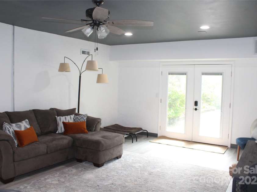 242 Birch Lane, Arden, NC 28704.  MLS# CAR4249293, YatesRealty ID 19164. Flex-space/Family Room also has a door leading outside.