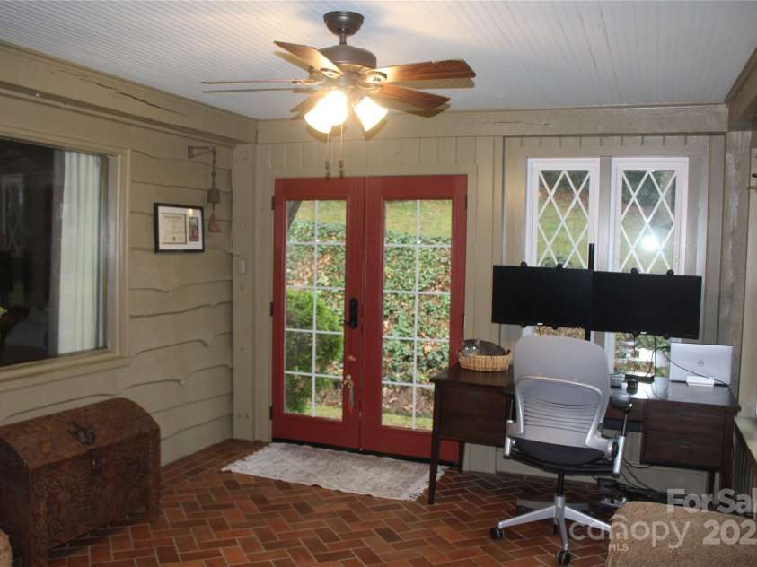 242 Birch Lane, Arden, NC 28704.  MLS# CAR4249293, YatesRealty ID 19164. Sunroom/Office also has doors leading out into the yard with a covered stoop.