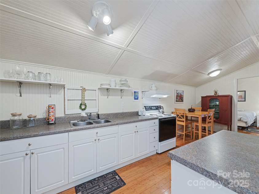 45 Boulder Drive, Waynesville, NC 28786.  MLS# CAR4183890, YatesRealty ID 19168. Kitchen in barn apartment