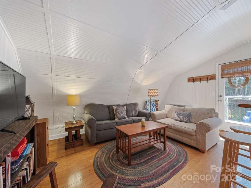 45 Boulder Drive, Waynesville, NC 28786.  MLS# CAR4183890, YatesRealty ID 19168. Living room in barn apartment