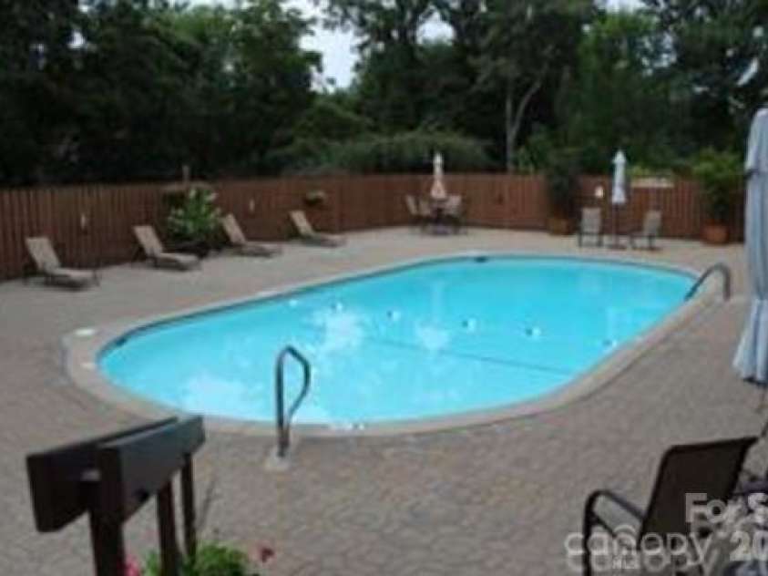 521 Crowfields Lane, Asheville, NC 28803.  MLS# CAR4361859, YatesRealty ID 19170. Heated Pool at Clubhouse