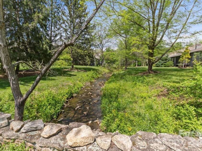 521 Crowfields Lane, Asheville, NC 28803.  MLS# CAR4361859, YatesRealty ID 19170. Lush & Lovely 72 acres.