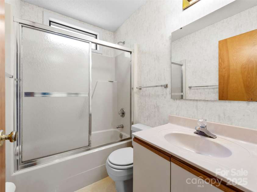 207 Trappers Trail, Hendersonville, NC 28739.  MLS# CAR4248625, YatesRealty ID 19173. 2nd Bathroom at end of Hall