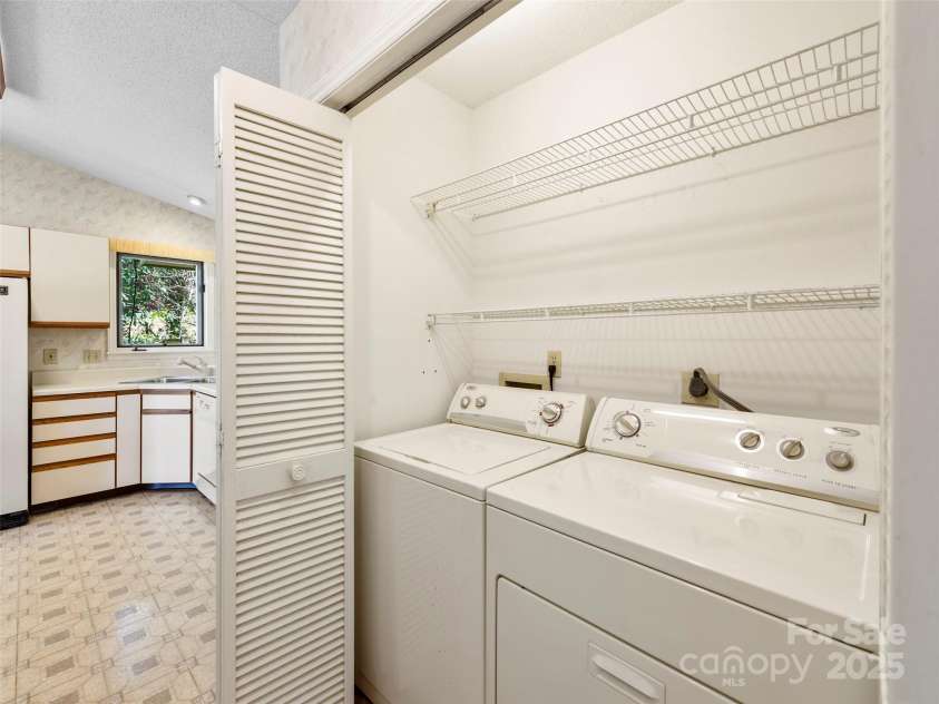 207 Trappers Trail, Hendersonville, NC 28739.  MLS# CAR4248625, YatesRealty ID 19173. Washer and Dryer off Kitchen