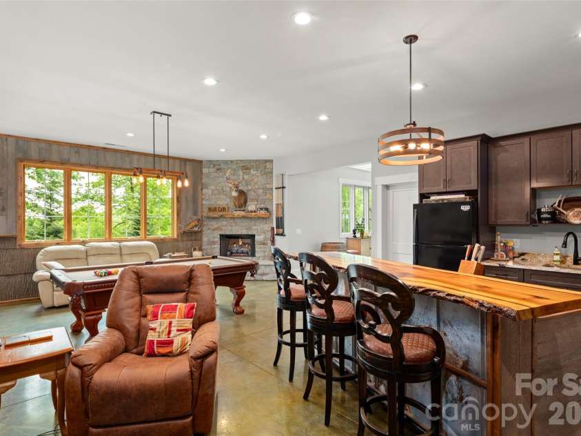 231 Tower Circle, Hendersonville, NC 28739.  MLS# CAR4372970, YatesRealty ID 19183. Kitchenette and fireplace