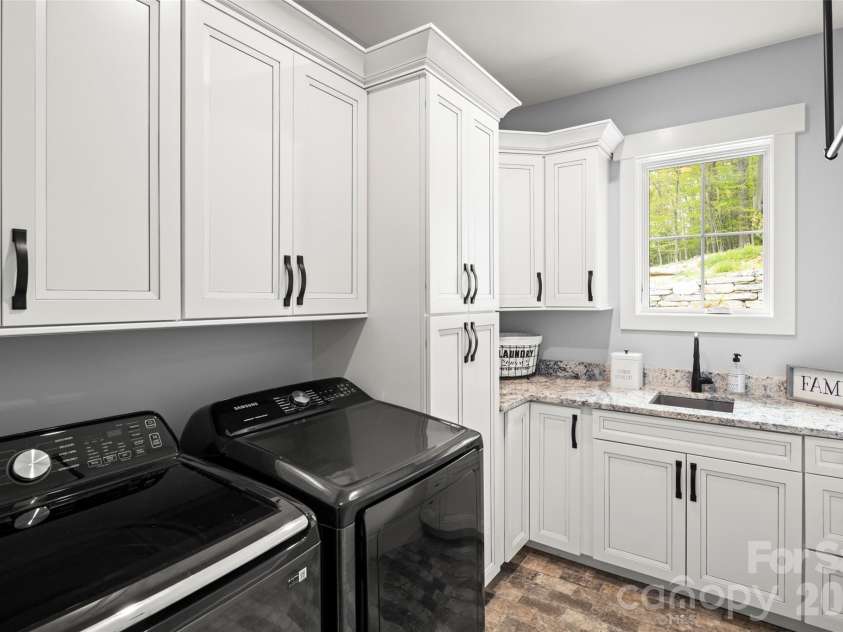 231 Tower Circle, Hendersonville, NC 28739.  MLS# CAR4372970, YatesRealty ID 19183. Main level laundry room