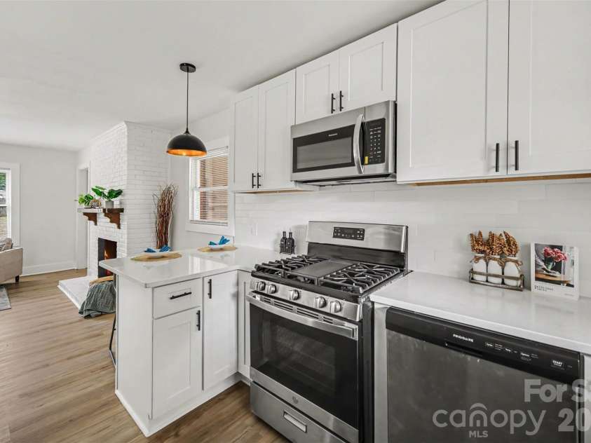 694 Forest Street, Concord, NC 28025.  MLS# CAR4367957, YatesRealty ID 19184. Kitchen with breakfast bar