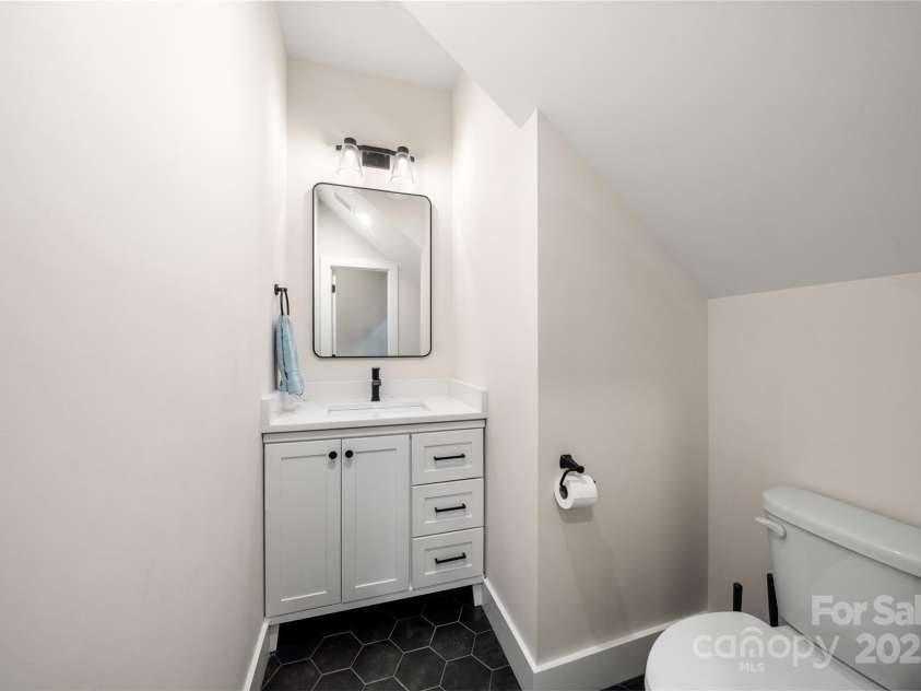 204 Maple Avenue, Marion, NC 28752.  MLS# CAR4260334, YatesRealty ID 19194. Powder room on main