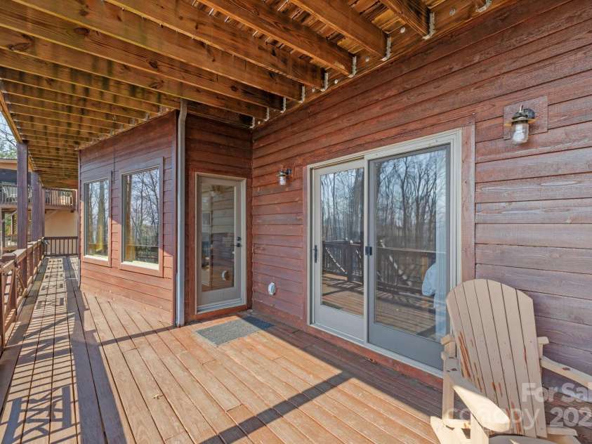 277 Kestrel Court, Sapphire, NC 28774.  MLS# CAR4238900, YatesRealty ID 19199. Lower level deck.