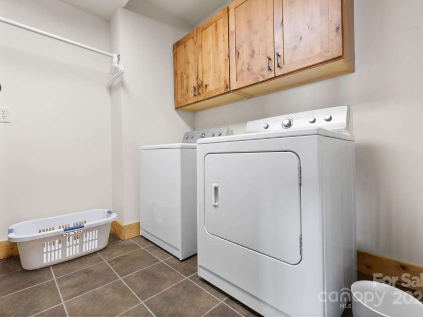 277 Kestrel Court, Sapphire, NC 28774.  MLS# CAR4238900, YatesRealty ID 19199. Lower level laundry room.