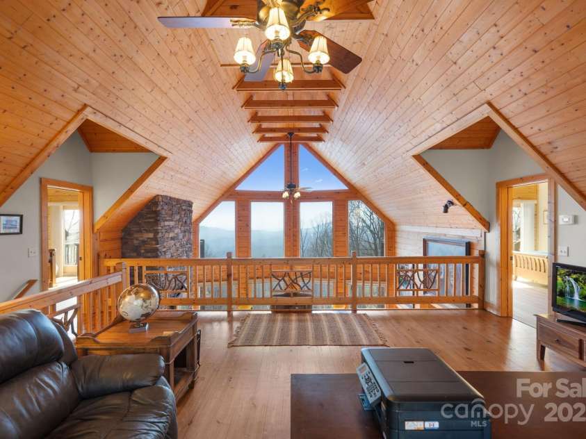 277 Kestrel Court, Sapphire, NC 28774.  MLS# CAR4238900, YatesRealty ID 19199. Open loft showcasing beam work and views.