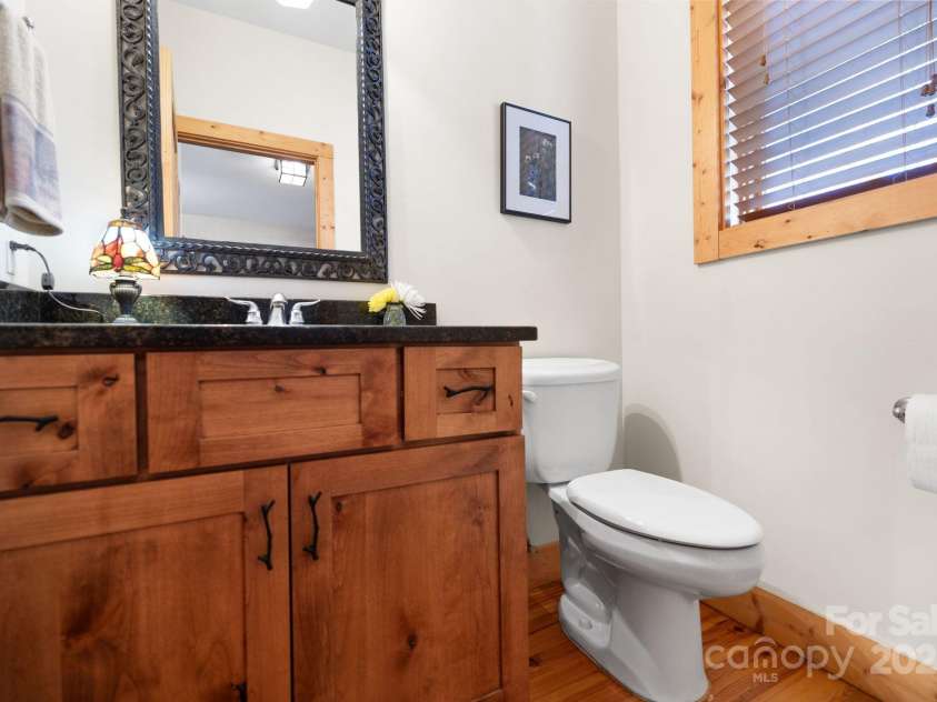 277 Kestrel Court, Sapphire, NC 28774.  MLS# CAR4238900, YatesRealty ID 19199. Powder room on main level.