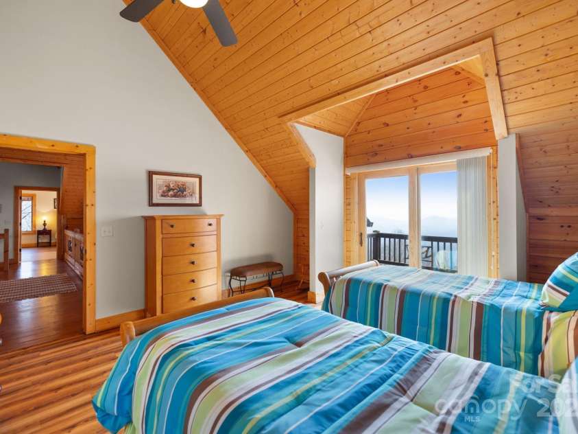 277 Kestrel Court, Sapphire, NC 28774.  MLS# CAR4238900, YatesRealty ID 19199. Upstairs guest bedroom