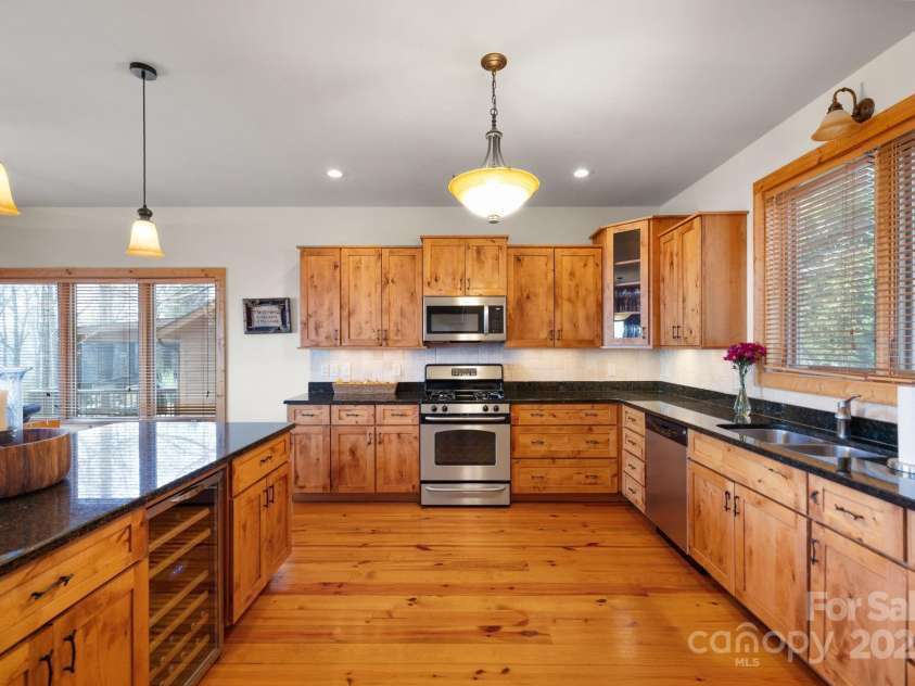 277 Kestrel Court, Sapphire, NC 28774.  MLS# CAR4238900, YatesRealty ID 19199. Well appointed kitchen with knotty alder solid cabinets.