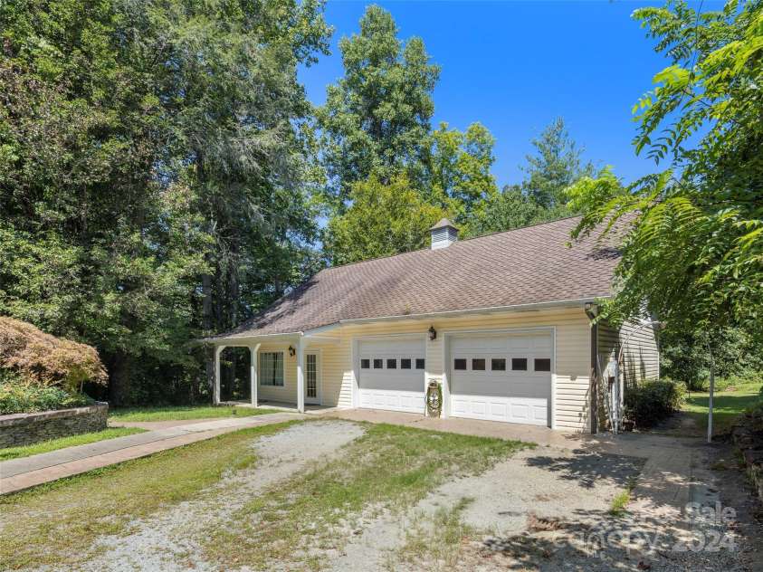4901 Brevard Road, Horse Shoe, NC 28742.  MLS# CAR4180919, YatesRealty ID 192. Guest house garage and studio apartment