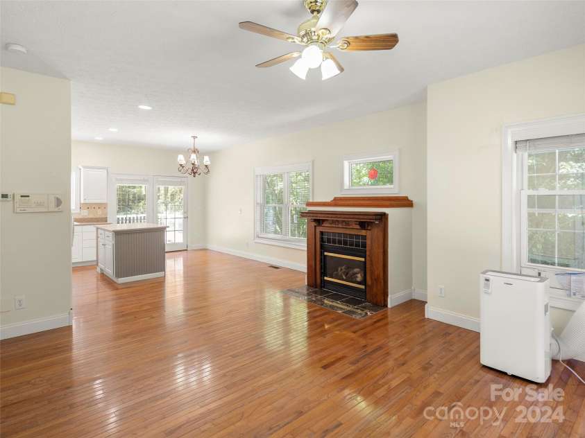 4901 Brevard Road, Horse Shoe, NC 28742.  MLS# CAR4180919, YatesRealty ID 192. Guest house living room