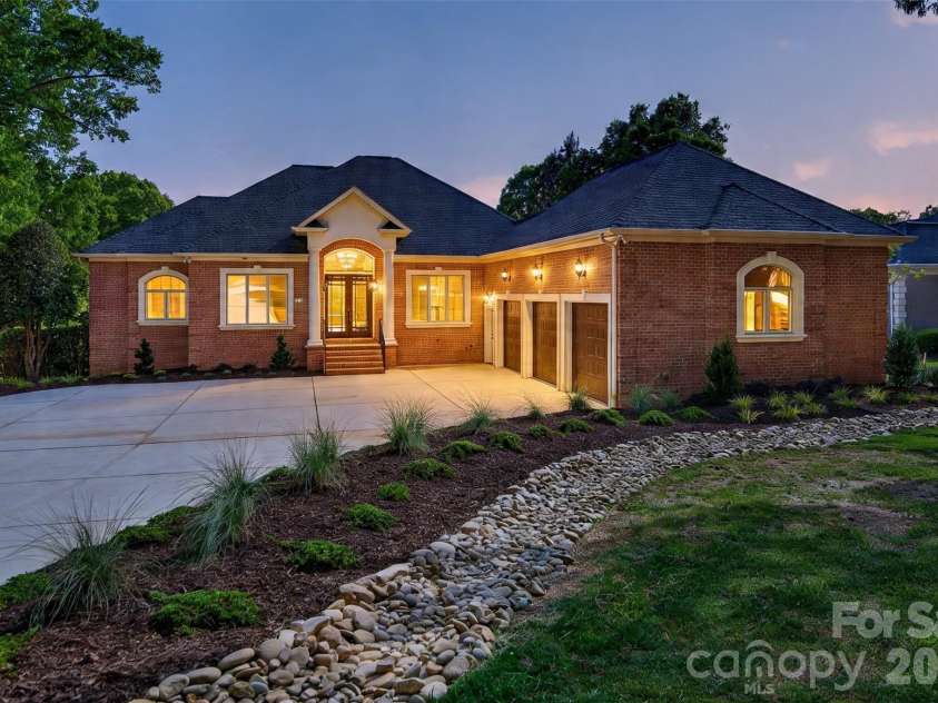 153 Plantation Drive, Mooresville, NC 28117.  MLS# CAR4365810, YatesRealty ID 19203. Front Elevation Sunset