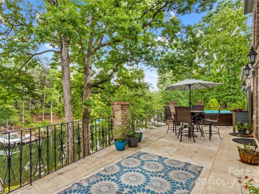 141 Ridge Top Road, Mooresville, NC 28117.  MLS# CAR4255912, YatesRealty ID 19205. Back deck expands the entire width of the home allowing for eating and sitting areas