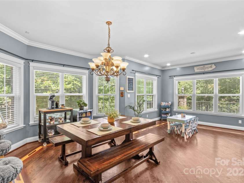 141 Ridge Top Road, Mooresville, NC 28117.  MLS# CAR4255912, YatesRealty ID 19205. Dining area has a bay window and wood floors with an inlay feature.