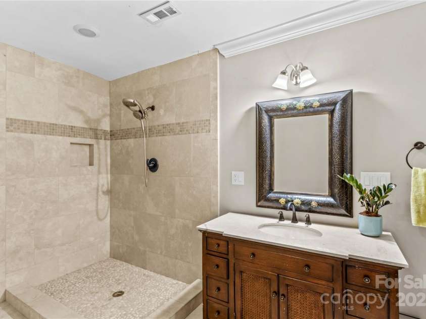 141 Ridge Top Road, Mooresville, NC 28117.  MLS# CAR4255912, YatesRealty ID 19205. Full bathroom located in basement - ideal for coming off of lake