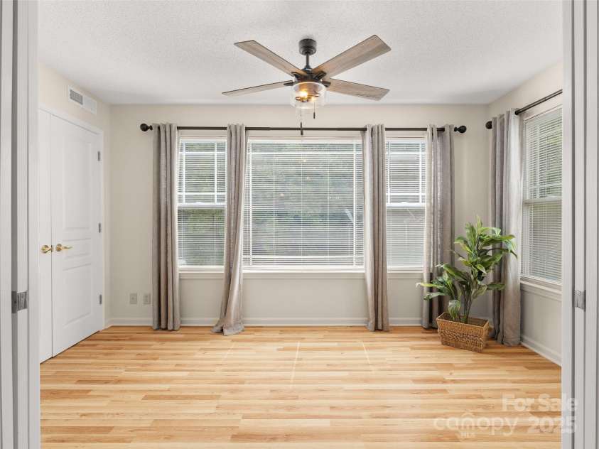 91 Morningside Lane, Hendersonville, NC 28792.  MLS# CAR4268520, YatesRealty ID 19206. Bright sunroom to enjoy the trees and birds