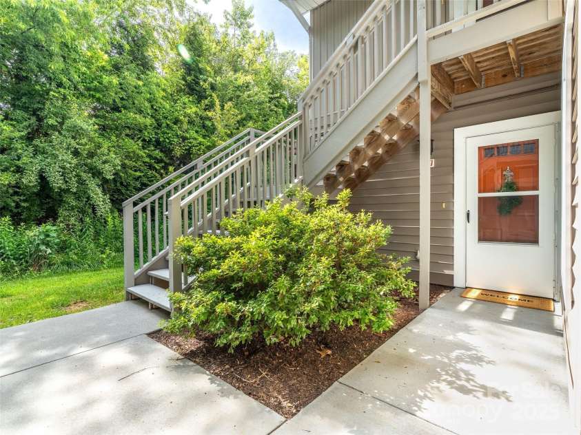 91 Morningside Lane, Hendersonville, NC 28792.  MLS# CAR4268520, YatesRealty ID 19206. Entry with privacy and trees