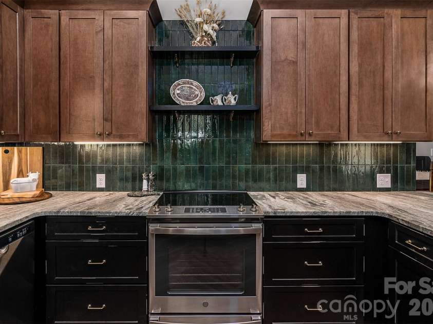 518 Sharpe Street, Statesville, NC 28677.  MLS# CAR4359455, YatesRealty ID 19209. Kitchen w/Stainless Appliances & Built-In Display Shelves