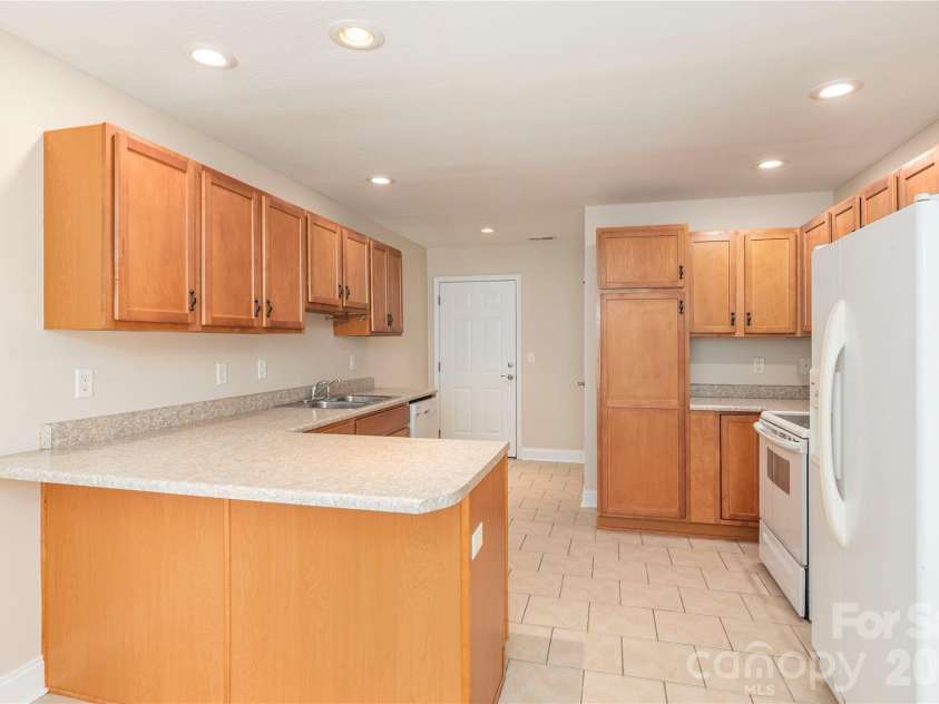 8 Kaylor Drive, Arden, NC 28704.  MLS# CAR4369533, YatesRealty ID 19216. Dining area looking into kitchen.