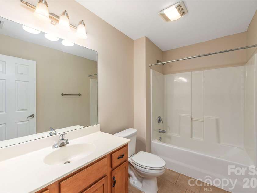8 Kaylor Drive, Arden, NC 28704.  MLS# CAR4369533, YatesRealty ID 19216. Guest bathroom.