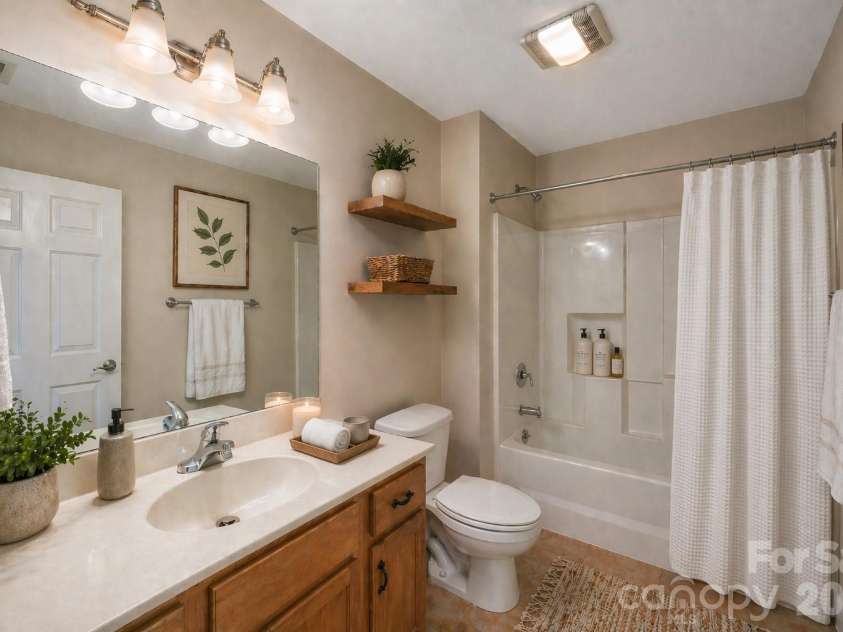 8 Kaylor Drive, Arden, NC 28704.  MLS# CAR4369533, YatesRealty ID 19216. Guest bathroom virtually staged.