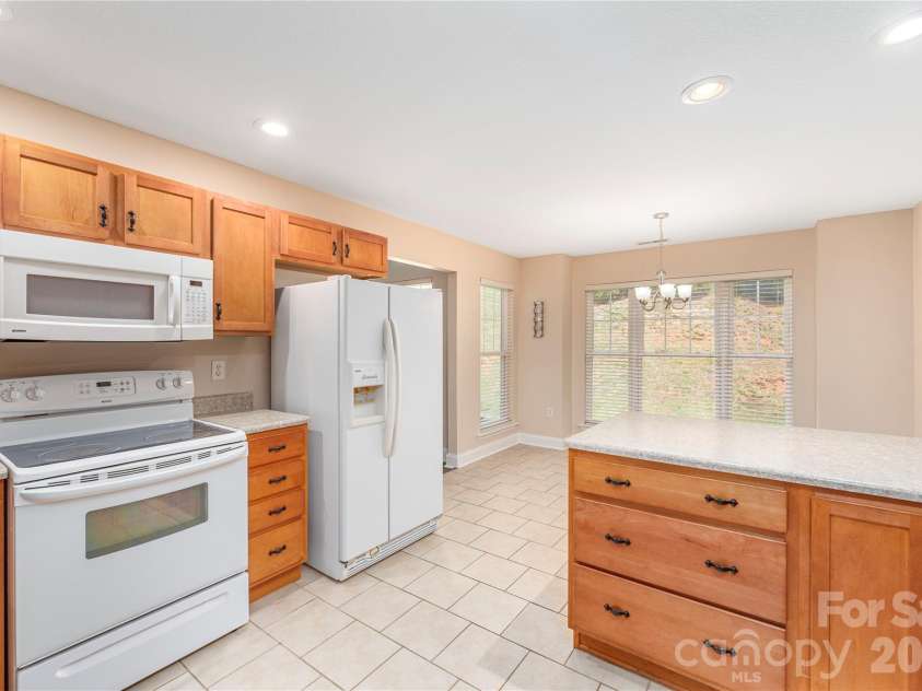 8 Kaylor Drive, Arden, NC 28704.  MLS# CAR4369533, YatesRealty ID 19216. Large light-filled kitchen.