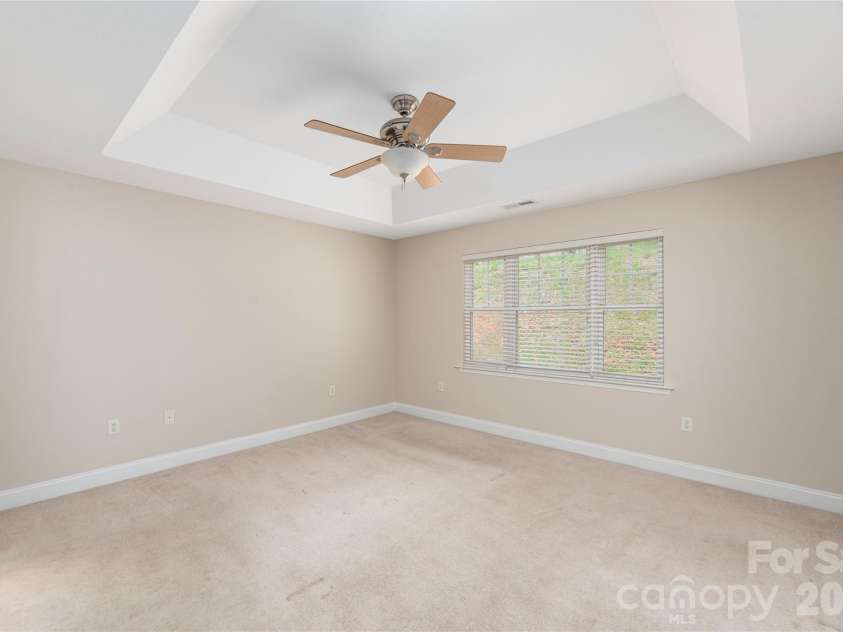 8 Kaylor Drive, Arden, NC 28704.  MLS# CAR4369533, YatesRealty ID 19216. Large primary bedroom.