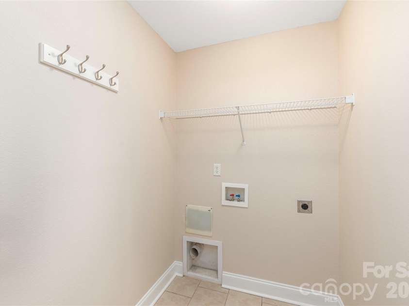 8 Kaylor Drive, Arden, NC 28704.  MLS# CAR4369533, YatesRealty ID 19216. Laundry/Utility closet off of the kitchen with ample storage.