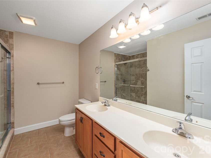 8 Kaylor Drive, Arden, NC 28704.  MLS# CAR4369533, YatesRealty ID 19216. Primary en-suite bathroom.