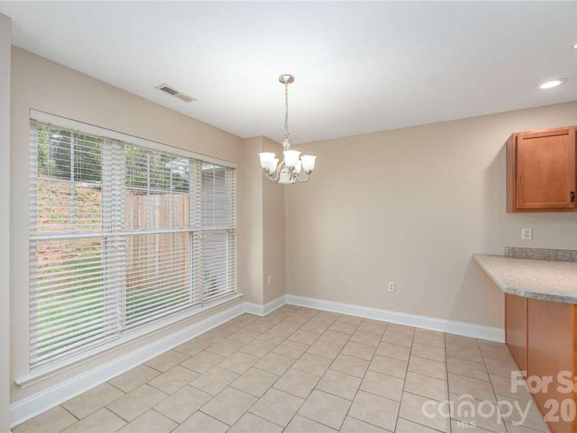 8 Kaylor Drive, Arden, NC 28704.  MLS# CAR4369533, YatesRealty ID 19216. Spacious dining area adjacent to the kitchen.